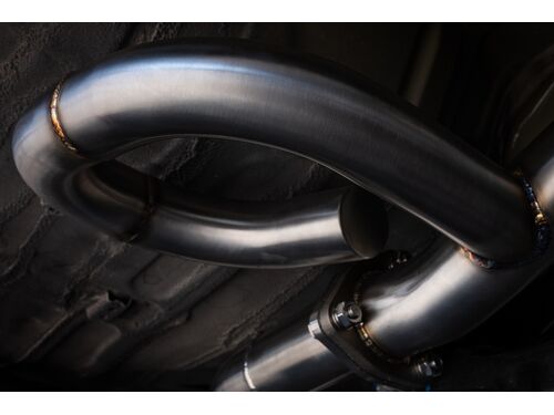 These dead tubes cycle exhaust back into the main stream to cancel out raspiness and drone and up the rumble and tone