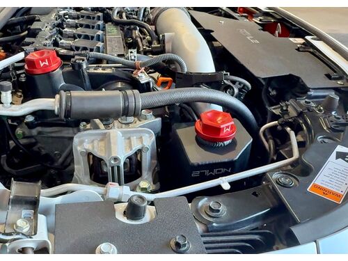 Pop the hood and this Coolant Tank instantly stands out